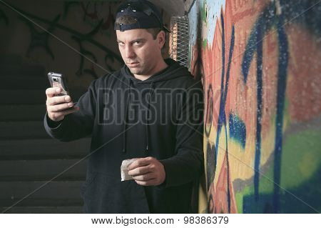 Drug dealer in a tunnel. A dark place to deal person.