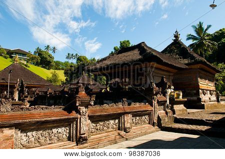 A man bathes in holy water pool in Tirta Empul temple