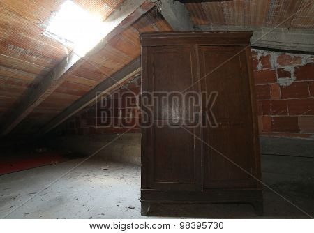 Wooden Wardrobe In The Dusty Attic