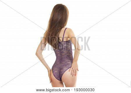 Slim young girl in sexy body with supple buttocks turned her back to the camera isolated on white background