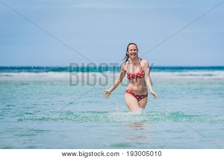 Woman Enjoying The Sea And Waves Of Atlantic Ocean.