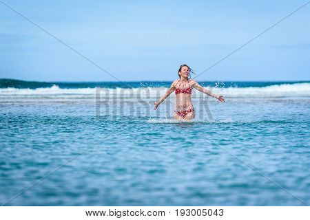 Woman Enjoying The Sea And Waves Of Atlantic Ocean.