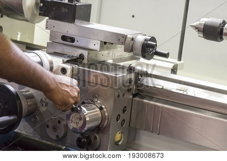 The operator use the lathe machine.Manual worker operate metal working