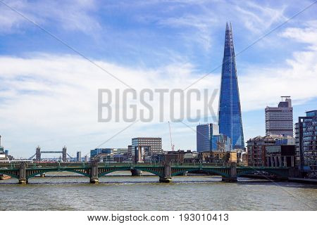 LONDON - APR 20 : The Shard building and riverside pictured on April 20th, 2013, in London. The Shard opened to the public on February 2013. Standing 309m, the Shard is the tallest building in Europe.