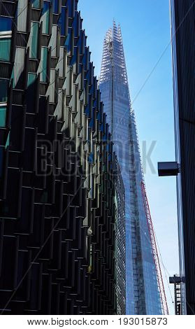 LONDON - APR 20 : The Shard building and riverside pictured on April 20th, 2013, in London. The Shard opened to the public on February 2013. Standing 309m, the Shard is the tallest building in Europe.