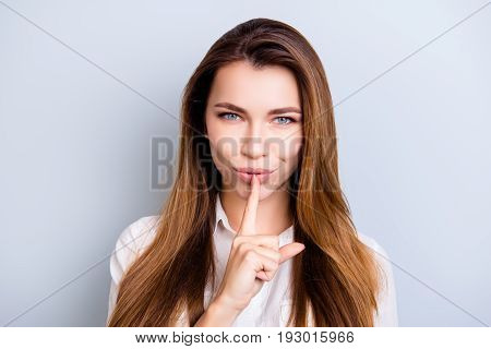 Shh! Keep My Secret. Attractive Flirty Girl In White Shirt Withnice Hairstyle Is Showing Someone To