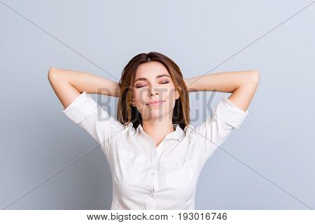 Time To Rest. Young Freelancer Is Relaxing With Closed Eyes, Hands Behind The Head, Dreaming And Enj