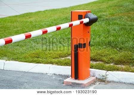 horizontal security barrier at the entrance to the car park