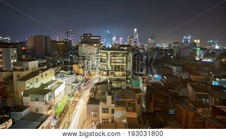 Pham Ngu Lao, backpaper street, in Saigon at night from a rooftop. Ho-Chi-Minh-City at night