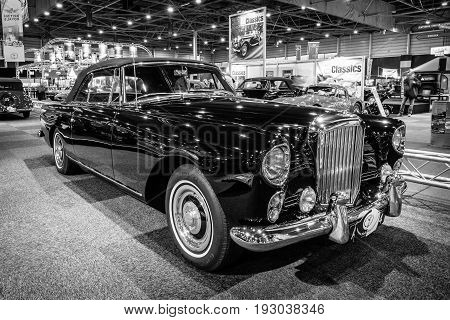MAASTRICHT NETHERLANDS - JANUARY 14 2016: High-performance luxury car Bentley Continental S2 Drophead Coupe by Park Ward 1963. Black and white. International Exhibition InterClassics & Topmobiel 2016