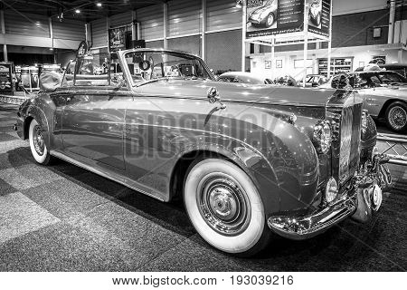 MAASTRICHT NETHERLANDS - JANUARY 14 2016: Luxury car Rolls-Royce Silver Cloud II Drophead Coupe 1962. Black and white. International Exhibition InterClassics & Topmobiel 2016