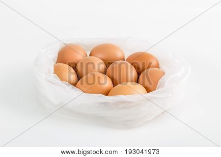 Eggs in plastic bag on white background.