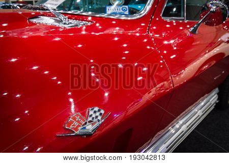 MAASTRICHT NETHERLANDS - JANUARY 15 2016: Detail and emblem of the sports car Chevrolet Corvette C2 