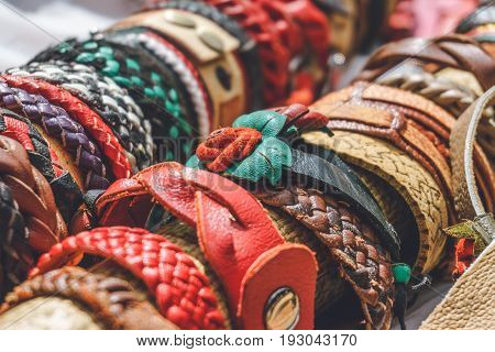 Braided handmade leather bracelets background copy space