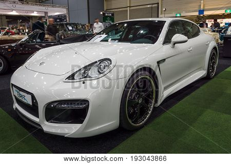 MAASTRICHT NETHERLANDS - JANUARY 15 2016: Full-size luxury car Porsche Panamera Grand GT 2012. International Exhibition InterClassics & Topmobiel 2016