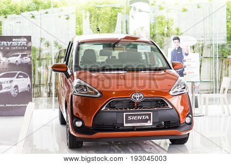 BANGKOK - JUNE 11: TOYOTA SIENTA orange color on display at Toyota Buzz Ratchapruck branch Showroom car in Bangkok Thailand.