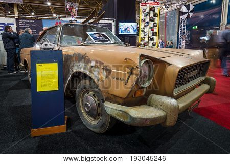 MAASTRICHT NETHERLANDS - JANUARY 15 2016: Rusty vintage car Fiat 2100 