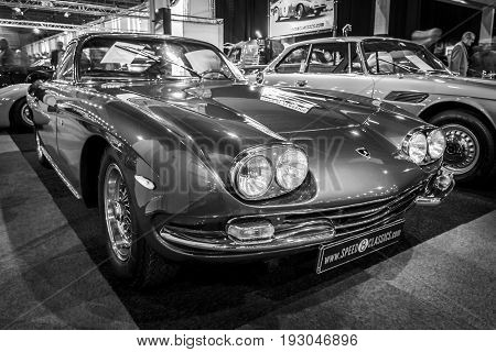 MAASTRICHT NETHERLANDS - JANUARY 15 2016: Grand tourer coupe Lamborghini 400 GT 2+2 1967. Black and white. International Exhibition InterClassics & Topmobiel 2016
