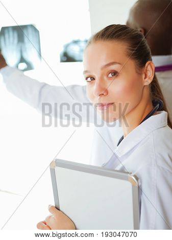 Doctors analyzing an x-ray in a meting. Doctors