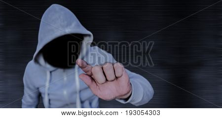Robber touhing glass against black background