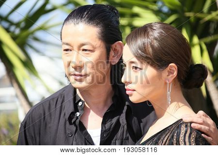 Nagase Masatoshi, Ayame Misaki attend the 'Hikari (Radiance)' photocall during the 70th annual Cannes Film Festival at Palais des Festivals on May 23, 2017 in Cannes, France. 