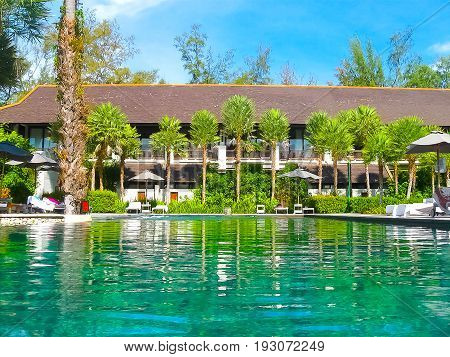 Nai Yang, Thailand - February 12, 2010: Beach side swimming pool at resort The Slate at Nai Yang, Thailand on February 12, 2010