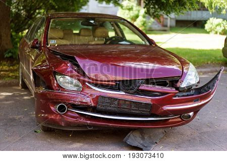 red car accident, damaged car on parking
