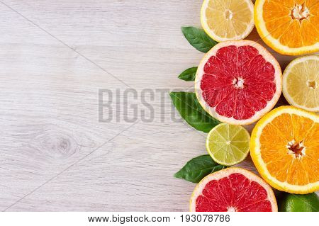 Juicy Citrus Fruits Cut Background Mint Leaf. Oranges, Lemons, Limes, Grapefruit, Mint Leaves On A B