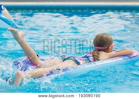 Girl having fun in the swimming pool
