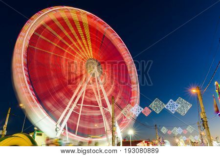 Rotating Ferris wheel in motion located in Badajoz Extremadura Spain