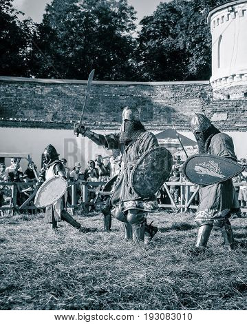 TROSTYANETS, UKRAINE - JUNE 25, 2017: Old Castle fest in action. Knights fight just beginning. This is 8 time traditional fest with historical costumes, foods and fights.