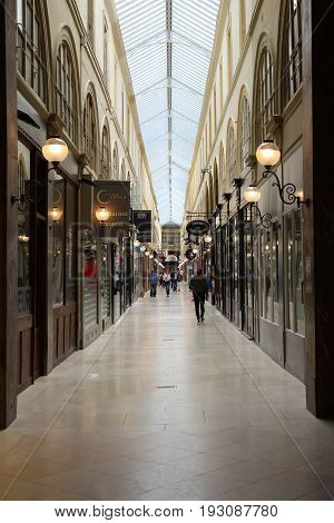PARIS, FRANCE - June 08, 2017: Interior of Passage Choiseul - shopping area with clothing stores, book stores, jewelers shops and art galleries.