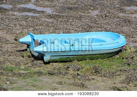 Boat tender on silt in a harbor in Brittany