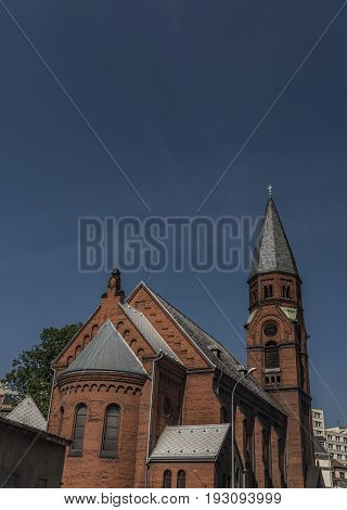 Red church in Usti nad Labem city with dark blue sky