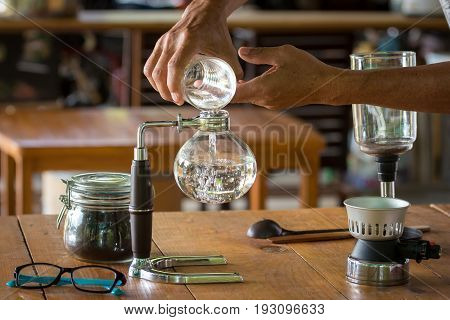 Close Up Of Siphon Vacuum, Coffee Cup And Siphon Vacuum Coffee Maker At Shop