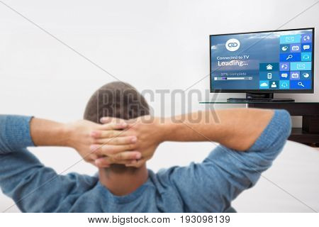 Rear view of busnessman relaxing on chair against various computer icons with progress bar 