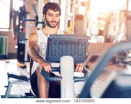 People working out in a gym, filtered image with lens flare effect