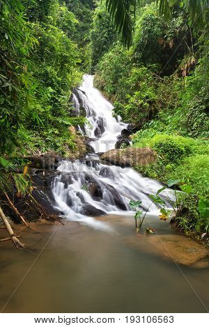 a cascade of water falling from a height, formed when a river or stream flows over a precipice or steep incline