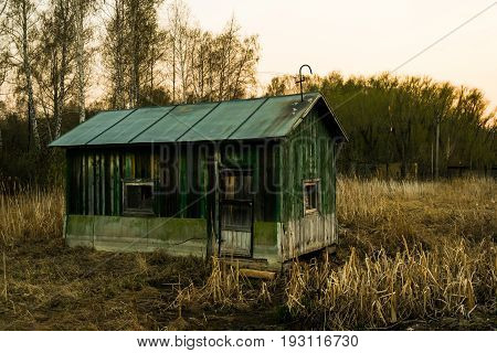 A lonely and abandoned hut in the forest.