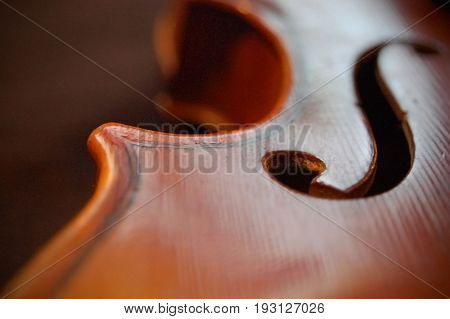 Extreme close-up of the intricate design on a violin.