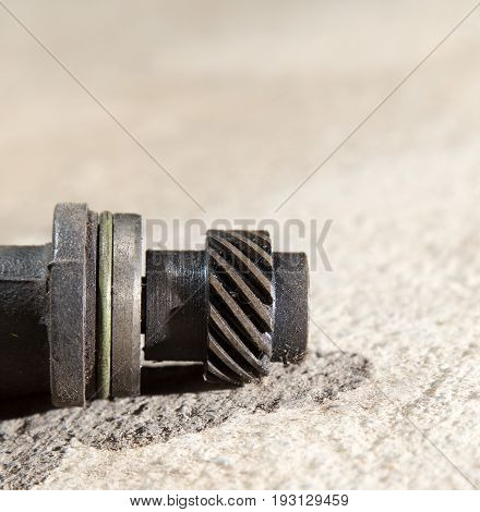 The part from the car lies on the concrete