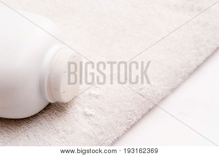 Talcum Powder On A Soft White Towel Background