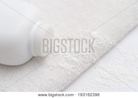 Talcum Powder On A Soft White Towel Background