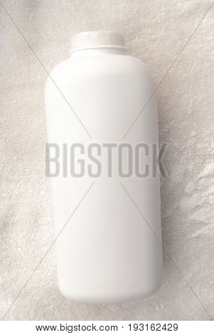 Talcum Powder On A Soft White Towel Background