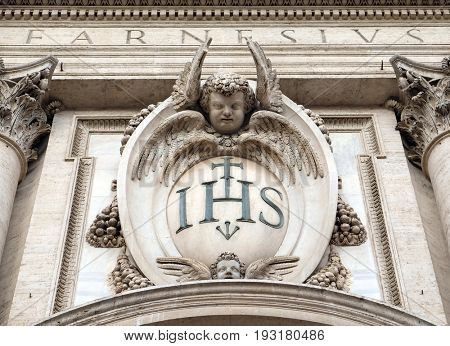 ROME, ITALY - SEPTEMBER 01: Christogram IHS, facade of the Church of the Gesu, mother church of the Society of Jesus, Rome, Italy on September 01, 2016.
