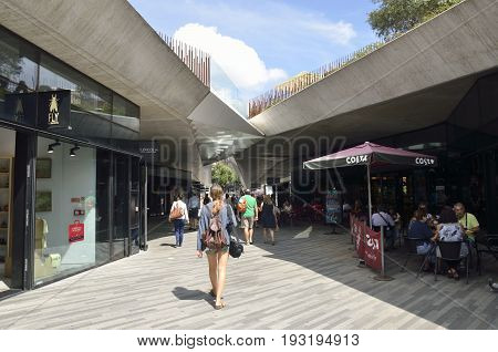 PORTO, PORTUGAL - AUGUST 7, 2015: People at Passageway of comercial center below of the Lisbon Plaza next to the Clerigos Tower in Porto portugal.