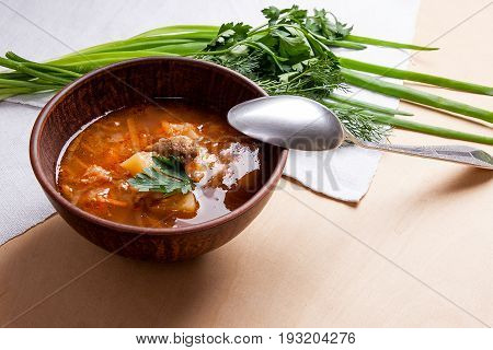 Borsch - Traditional Ukrainian And Russian Red Beetroot Soup With Red Beets In Clay Bowl With Metal