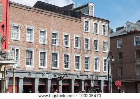 NEW ORLEANS, LA - APRIL 13: View of Street in the French Quarter of New Orleans, Louisiana showing historic buldings with unique architecture on April 13, 2014