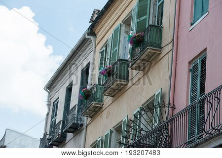 NEW ORLEANS, LA - APRIL 13: View of Street in the French Quarter of New Orleans, Louisiana showing historic buldings with unique architecture on April 13, 2014