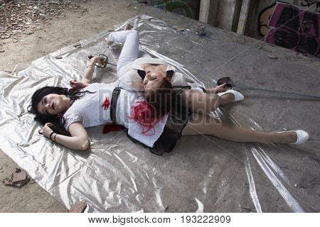 Crime Scene With Two Fashionable Women  In A Darkplace
